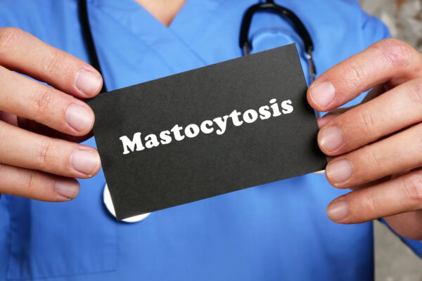 Health care concept about Mastocytosis with inscription on the piece of paper.